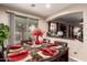 Dining area with table, matching chairs, sliding doors and an archway to an adjacent living space at 17541 W Statler Dr, Surprise, AZ 85388