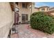 Inviting front entrance showcasing a decorative door, manicured landscaping, and a charming walkway, creating a warm welcome at 17541 W Statler Dr, Surprise, AZ 85388