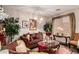 Inviting living room featuring stylish decor, comfortable seating, and large, bright windows at 17541 W Statler Dr, Surprise, AZ 85388