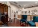Bright loft area with hardwood floors, comfortable seating, and access to multiple rooms at 17541 W Statler Dr, Surprise, AZ 85388