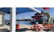 Community pool area with blue canopies, red water slide, and picnic tables nearby at 17541 W Statler Dr, Surprise, AZ 85388