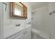 Neat bathroom featuring a shower-tub, sink, vanity, medicine cabinet and window at 1763 W Pepper Pl, Mesa, AZ 85201