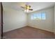 Bedroom with a ceiling fan, carpet floors and bright window at 1763 W Pepper Pl, Mesa, AZ 85201