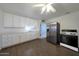 Bright kitchen with stainless steel appliances and wood-look tile flooring at 1763 W Pepper Pl, Mesa, AZ 85201