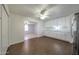 Kitchen with white cabinets, stainless appliances, and views to other rooms at 1763 W Pepper Pl, Mesa, AZ 85201