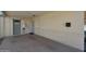 Outdoor patio with a water heater and a metal gated entry at 1763 W Pepper Pl, Mesa, AZ 85201
