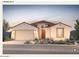 Inviting single-story home with a two-car garage and beautiful desert landscaping at 17651 W Palo Verde Dr, Litchfield Park, AZ 85340