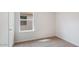 Bright bedroom featuring neutral carpet, natural light from a window, and fresh paint ready for personal touches at 1828 W Sheridan Ave, Apache Junction, AZ 85120