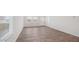 Bright room with hardwood flooring, neutral walls, and natural light from the windows at 1828 W Sheridan Ave, Apache Junction, AZ 85120