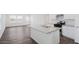 Modern kitchen featuring stainless steel appliances, granite countertops, and open living area at 1828 W Sheridan Ave, Apache Junction, AZ 85120