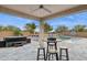 Beautiful backyard oasis with pool, spa, and seating, perfect for relaxation and entertaining at 18324 W Highland Ave, Goodyear, AZ 85395