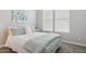Serene bedroom with coordinated pillows and art at 18324 W Highland Ave, Goodyear, AZ 85395