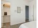 Bedroom featuring an adjacent walk-in closet on the left and a connecting door to another room at 18324 W Highland Ave, Goodyear, AZ 85395