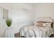 Bedroom featuring a decorative headboard, coordinated pillows, and modern decor at 18324 W Highland Ave, Goodyear, AZ 85395