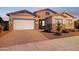 Charming single-Gathering home showcasing a well-maintained lawn and three-car garage at 18324 W Highland Ave, Goodyear, AZ 85395