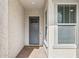 Inviting entryway features a stylish front door and brick flooring, creating a warm welcome at 18324 W Highland Ave, Goodyear, AZ 85395