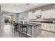 Bright kitchen features a center island with barstool seating and white cabinetry at 18324 W Highland Ave, Goodyear, AZ 85395