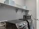 Laundry room featuring modern black washer and dryer at 18324 W Highland Ave, Goodyear, AZ 85395