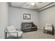Relaxing living area with neutral tones, comfortable seating and modern decor elements at 18324 W Highland Ave, Goodyear, AZ 85395