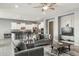 An open-concept living room with a sleek island and modern white cabinetry at 18324 W Highland Ave, Goodyear, AZ 85395
