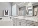 Bright primary bathroom with double vanity, garden tub and glass enclosed shower at 18324 W Highland Ave, Goodyear, AZ 85395