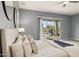 Beautiful bedroom featuring a sliding glass door that leads to a firepit and outdoor living space at 18324 W Highland Ave, Goodyear, AZ 85395