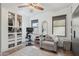 Bright primary bedroom with a sitting area, walk-in closet, and natural light at 18327 N Summerbreeze Way, Surprise, AZ 85374