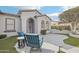 Inviting front porch with comfortable seating, perfect for enjoying the outdoors, and updated landscaping at 18327 N Summerbreeze Way, Surprise, AZ 85374