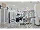 Modern kitchen boasts stainless steel appliances, granite countertops, and ample cabinet space at 18327 N Summerbreeze Way, Surprise, AZ 85374