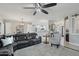 Spacious living room with an open layout, plush seating, and a seamless flow to the adjacent kitchen at 18327 N Summerbreeze Way, Surprise, AZ 85374