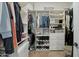 Well-organized walk-in closet with shelving and drawers for ample storage at 18327 N Summerbreeze Way, Surprise, AZ 85374