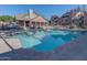 Beautiful community pool with nearby lounge chairs, a nearby grilling area, and pristine, clear blue water at 200 E Southern Ave # 117, Tempe, AZ 85282