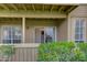 Inviting covered patio with sliding glass doors, views of the interior, and beautiful greenery at 200 E Southern Ave # 117, Tempe, AZ 85282