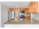 Well-equipped kitchen with stainless steel appliances and granite countertops for modern living at 200 E Southern Ave # 117, Tempe, AZ 85282