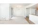 Spacious living room with neutral carpet and sliding glass doors, leading to outdoor balcony at 200 E Southern Ave # 117, Tempe, AZ 85282