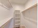 Bright walk-in closet features ladder and wooden closet rods for neat and organized storage at 200 E Southern Ave # 117, Tempe, AZ 85282