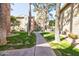 Picturesque walkway through the community's lush landscaping and well-maintained lawns at 200 E Southern Ave # 117, Tempe, AZ 85282