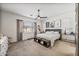 Bright bedroom featuring a ceiling fan, neutral walls, and stylish decor at 22744 E Stonecrest Dr, Queen Creek, AZ 85142