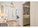 Inviting foyer featuring beautiful wood floors, stylish decor, and a view into the exercise room at 22744 E Stonecrest Dr, Queen Creek, AZ 85142