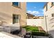 Private backyard with brick pathway, artificial turf, and raised garden beds at 2395 W Riverside St, Chandler, AZ 85248