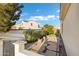 Private backyard featuring decorative stone pathway, mature landscaping and privacy wall at 2395 W Riverside St, Chandler, AZ 85248