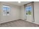 Inviting bedroom featuring carpet flooring, dual windows providing natural light, and neutral paint at 2395 W Riverside St, Chandler, AZ 85248