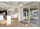 Open-plan dining area with chandelier lighting, large window and patio access at 2395 W Riverside St, Chandler, AZ 85248