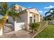 Charming home showcasing stucco exterior, tile roof, lush landscaping, and a gated entrance at 2395 W Riverside St, Chandler, AZ 85248