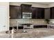Granite countertops and stainless steel appliances in modern kitchen at 2395 W Riverside St, Chandler, AZ 85248
