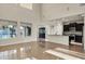Open living area featuring tile flooring and kitchen access at 2395 W Riverside St, Chandler, AZ 85248