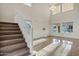 Bright living room featuring high ceilings, large windows, and tile flooring at 2395 W Riverside St, Chandler, AZ 85248