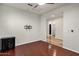 Bright living room with hardwood floors and a dark wood dresser at 2395 W Riverside St, Chandler, AZ 85248