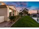 Tranquil water view featuring a brick pathway, mature landscaping and lush green lawn at 2395 W Riverside St, Chandler, AZ 85248