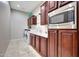 Bright laundry room featuring side by side machines, ample cabinet storage, and a convenient sink at 29512 N 128Th Ln, Peoria, AZ 85383